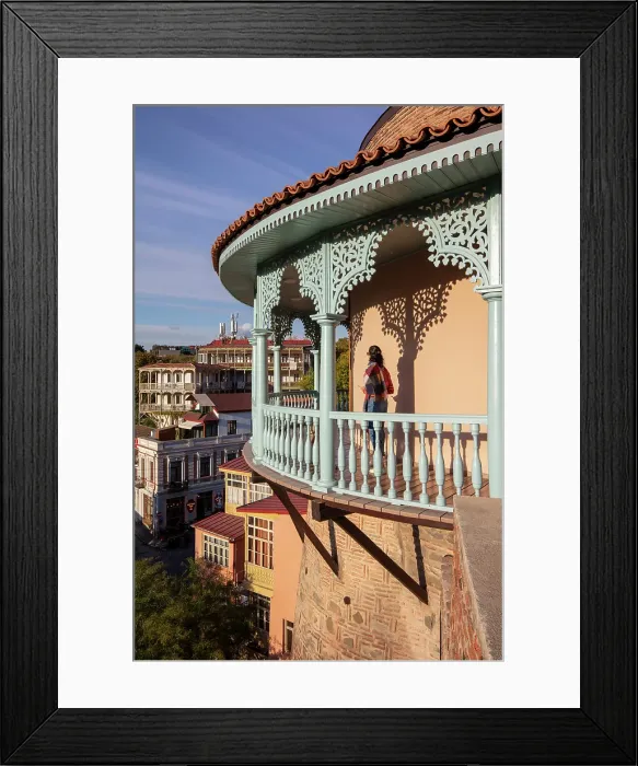 Framed Print : A tourist stands on the blue balcony of the Queen Darejan's Palace, Tbilisi, Georgia Framed Print : A tourist stands on the blue balcony of the Queen Darejan's Palace, Tbilisi, Georgia