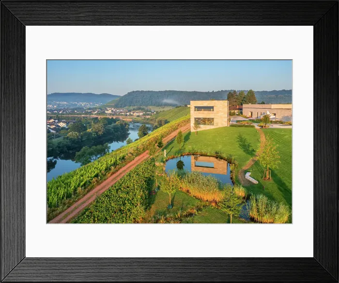 Framed Print : Aerial view at the Van Volxem winery and vinothek with river Saar, Wiltingen, Rhineland-Palatinate, Germany Framed Print : Aerial view at the Van Volxem winery and vinothek with river Saar, Wiltingen, Rhineland-Palatinate, Germany