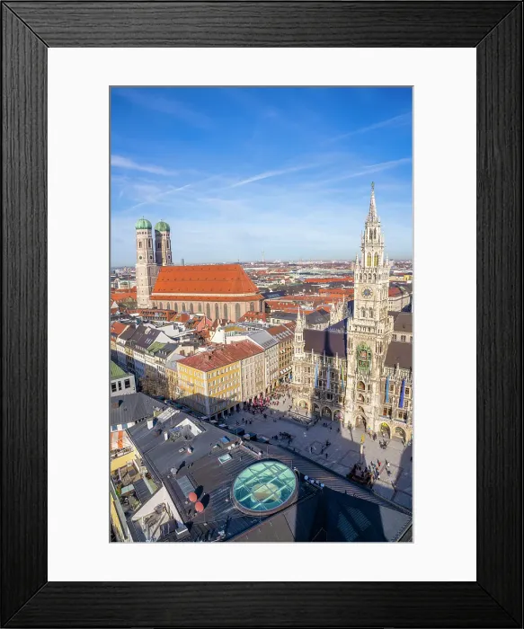 Framed Print : Aerial view of Marienplatz square with Munich's historic Neues Rathaus and Frauenkirche cathedral, highlighting iconic Bavarian architecture under a clear blue sky Framed Print : Aerial view of Marienplatz square with Munich's historic Neues Rathaus and Frauenkirche cathedral, highlighting iconic Bavarian architecture under a clear blue sky