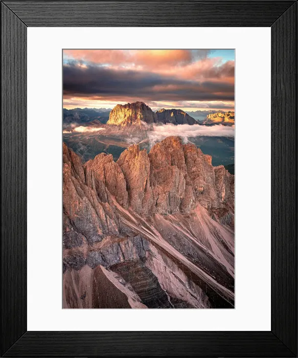 Framed Print : Idyllic sky with clouds at sunset over Puez Odle Nature Park and Sassolungo in autumn, helicopter view, Dolomites, Italy Framed Print : Idyllic sky with clouds at sunset over Puez Odle Nature Park and Sassolungo in autumn, helicopter view, Dolomites, Italy