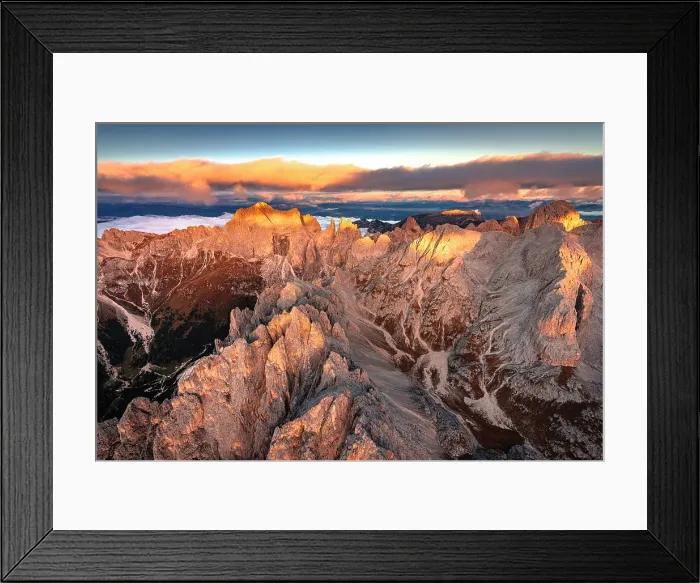 Framed Print : Aerial view of Catinaccio (Rosengarten), Cima Catinaccio, and Torri Del Vajolet peaks lit by dawn in autumn, Dolomites, Italy