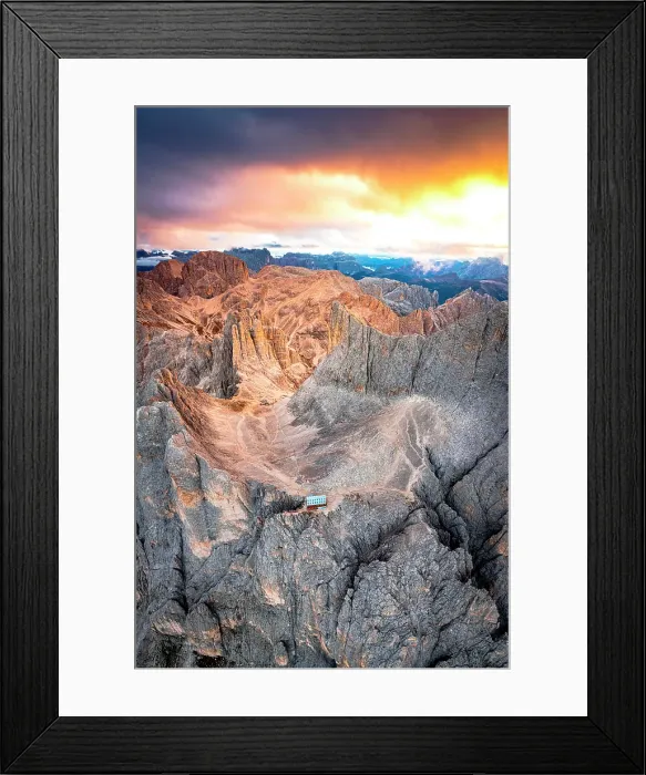Framed Print : Aerial view of Rifugio Passo Santner mountain hut and Torri Del Vajolet under a fiery sky at dawn in autumn, Dolomites, Italy Framed Print : Aerial view of Rifugio Passo Santner mountain hut and Torri Del Vajolet under a fiery sky at dawn in autumn, Dolomites, Italy