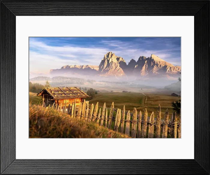 Framed Print : Autumn mist over Sassolungo and Sassopiatto and traditional huts at Seiser Alm plateau, Dolomites, South Tyrol, Italy