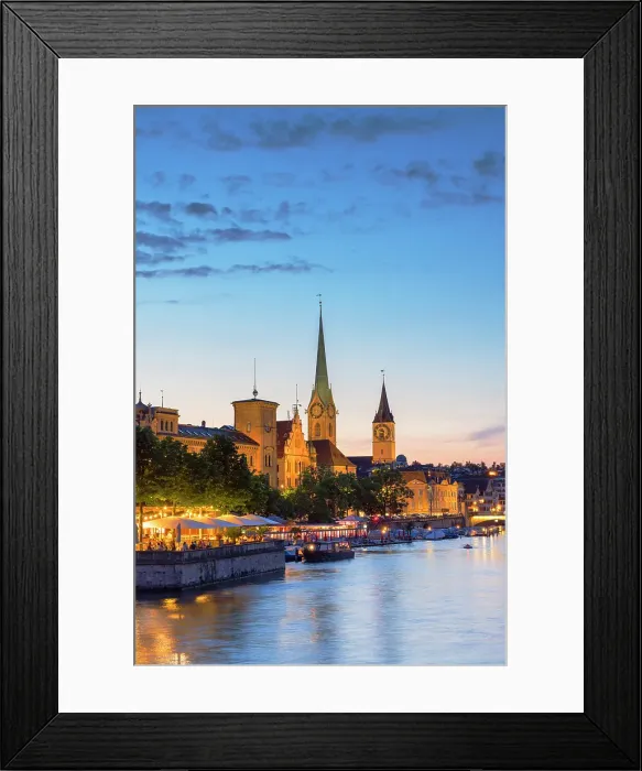 Framed Print : Fraumunster church, St Peter church and outdoor beer garden on Limmat River at dusk, Zurich, Switzerland Framed Print : Fraumunster church, St Peter church and outdoor beer garden on Limmat River at dusk, Zurich, Switzerland