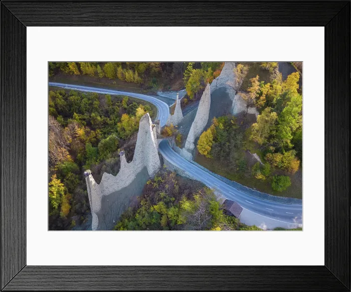 Framed Print : Aerial view of the Pyramides d'Euseigne in autumn. Euseigne, Val d'Herens, Canton of Valais, Switzerland