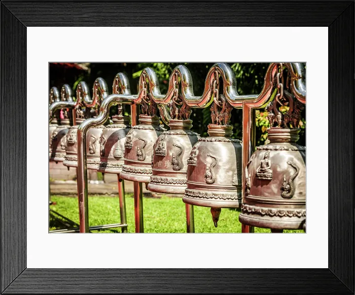 Framed Print : Traditional hanging brass prayers bells in a row in a buddhist temple, Thailand Framed Print : Traditional hanging brass prayers bells in a row in a buddhist temple, Thailand
