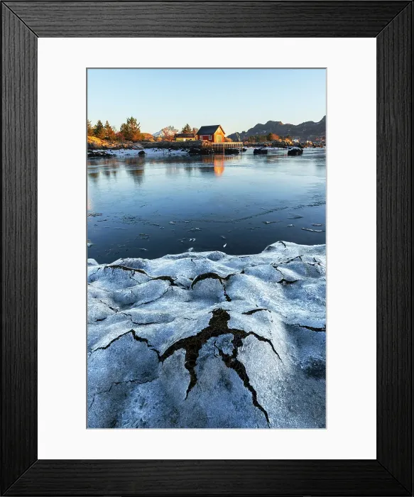 Framed Print : Low tide ice patterns and a solitary wooden house along the shore of the fjord seen at sunrise, Ballstad, Vestvagoy, Lofoten Islands, Nordland, Norway, Scandinavia
