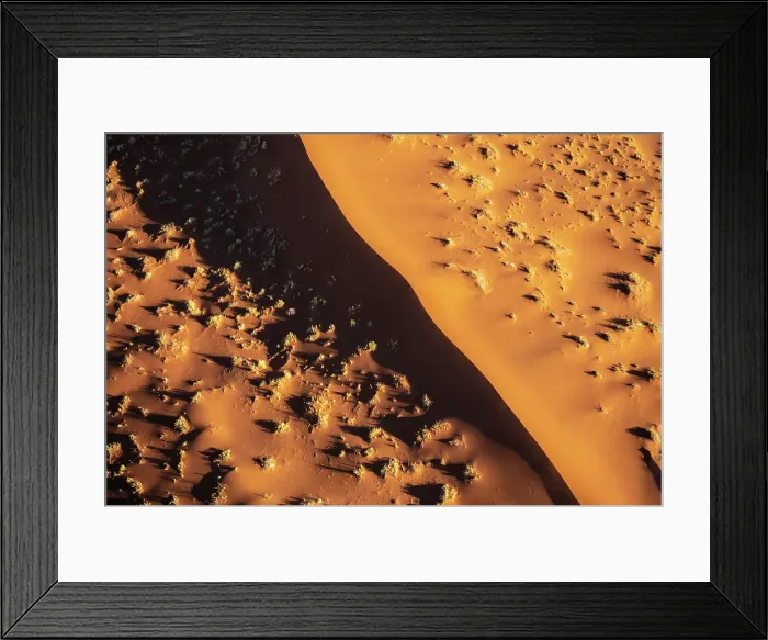 Framed Print : Aerial view of golden sand dunes at sunrise, Sossusvlei, Namib-Naukluft National Park, Namib Desert, Namibia Framed Print : Aerial view of golden sand dunes at sunrise, Sossusvlei, Namib-Naukluft National Park, Namib Desert, Namibia