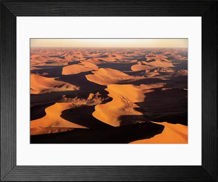 Framed Print : Aerial view of sprawling orange sand dunes at sunrise, Sossusvlei, Namib-Naukluft National Park, Namib Desert, Namibia