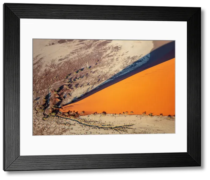 Framed Print : Aerial view of orange sand dune from helicopter, Sossusvlei, Namib-Naukluft National Park, Namib Desert, Namibia Framed Print : Aerial view of orange sand dune from helicopter, Sossusvlei, Namib-Naukluft National Park, Namib Desert, Namibia