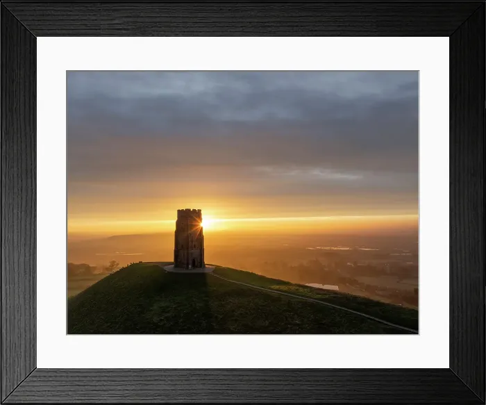Framed Print : Sunrise behind St Michaels Tower on Glastonbury Tor, Somerset, England. Winter (February) 2024