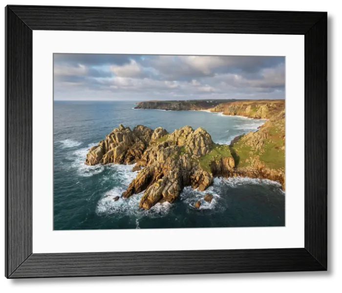Framed Print : Aerial view of Treryn Dinas headland and Logan Rock near Porthcurno on the west coast of Cornwall, England. Winter (January) 2025 Framed Print : Aerial view of Treryn Dinas headland and Logan Rock near Porthcurno on the west coast of Cornwall, England. Winter (January) 2025