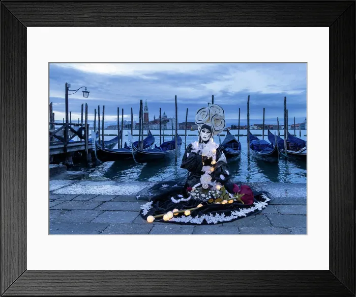 Framed Print : A woman in a flowery costume sits by the lagoon during the Venice Carnival, Venice, Italy Framed Print : A woman in a flowery costume sits by the lagoon during the Venice Carnival, Venice, Italy