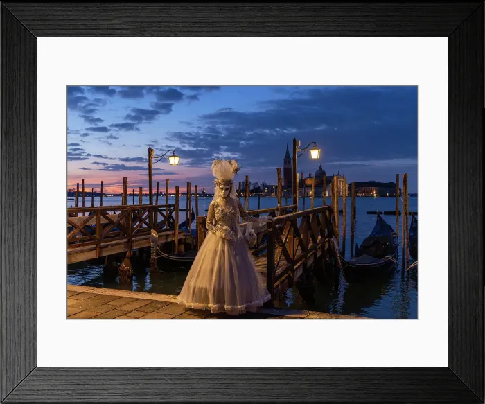 Framed Print : A woman in costume stands by the lagoon during the Venice Carnival, Venice, Italy Framed Print : A woman in costume stands by the lagoon during the Venice Carnival, Venice, Italy