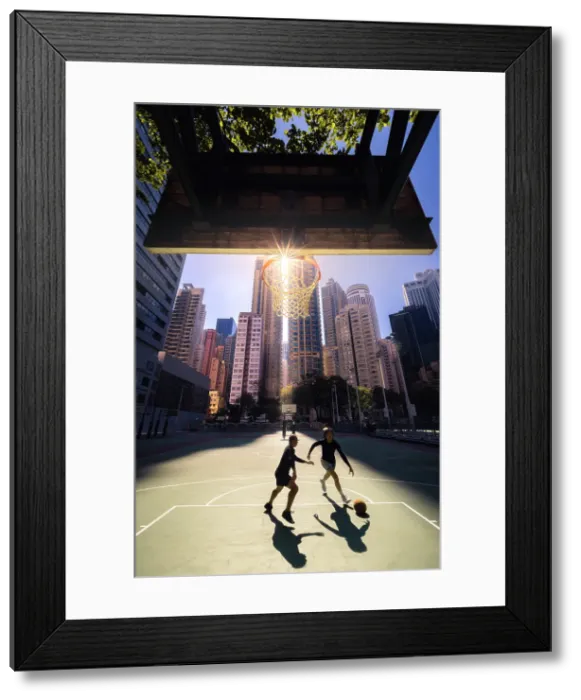 Framed Print : Two guys playing basketball in the middle of the buildings, Wan Chai, Hong Kong, China, Asia