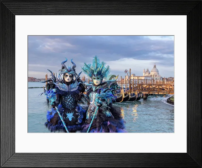 Framed Print : Two people dressed as blue dragons stand by the lagoon during the Venice Carnival, Venice, Italy Framed Print : Two people dressed as blue dragons stand by the lagoon during the Venice Carnival, Venice, Italy