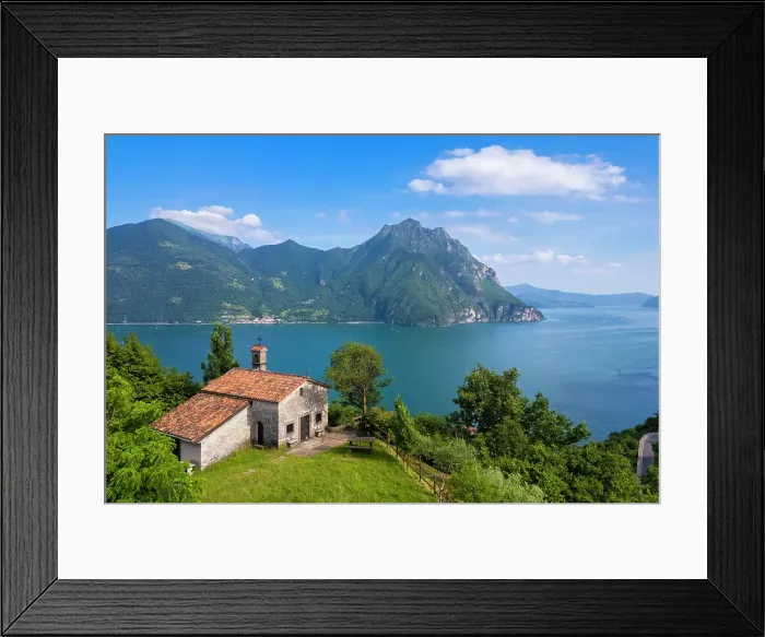 Framed Print : small church of San Lorenzo dominating Lake Iseo in summer. Castro, Iseo Lake, Bergamo district, Lombardy, Italy