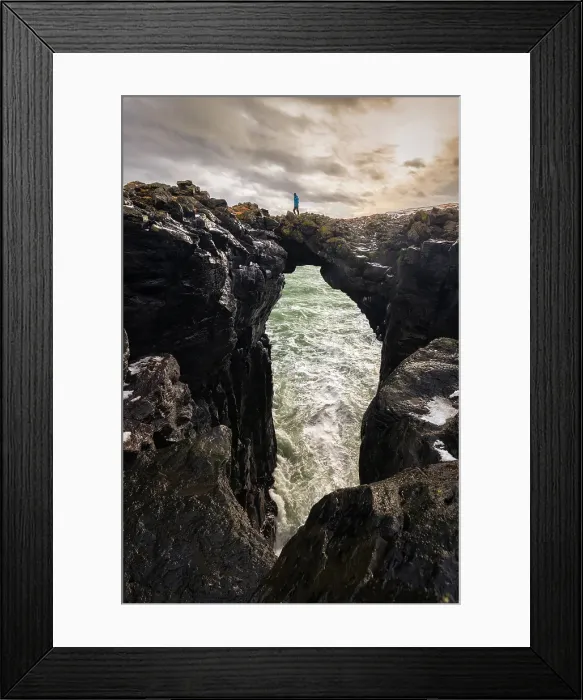Framed Print : View of a man standing on the Stone Bridge. Arnarstapi, Snaefellsnes peninsula, Iceland (MR) Framed Print : View of a man standing on the Stone Bridge. Arnarstapi, Snaefellsnes peninsula, Iceland (MR)