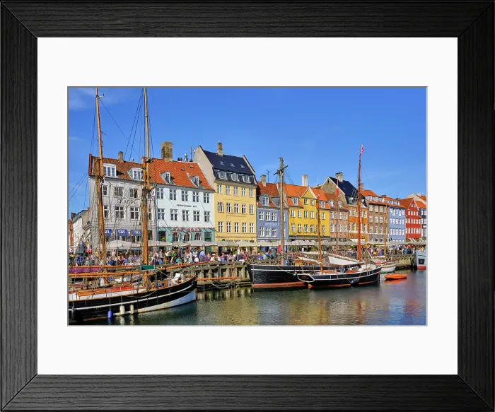 Framed Print : Nyhavn, or New Harbour, is a 17th-century waterfront, canal and entertainment district, full of restaurants and bars, in Copenhagen, Denmark Framed Print : Nyhavn, or New Harbour, is a 17th-century waterfront, canal and entertainment district, full of restaurants and bars, in Copenhagen, Denmark