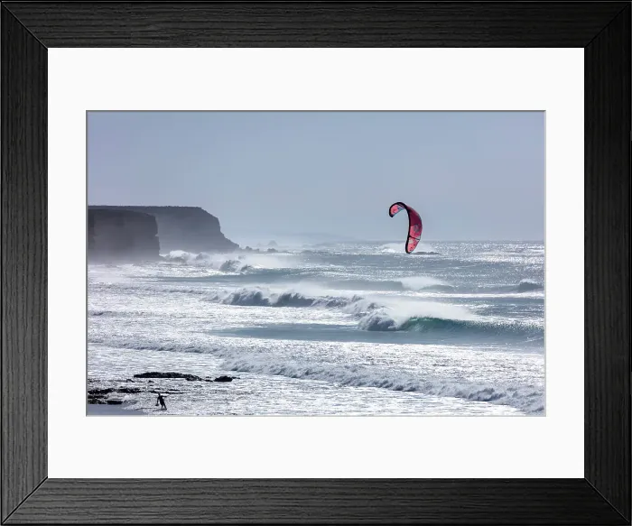 Framed Print : A man flies a kite on Playa del Castillo, Fuerteventura, Canary Islands, Spain Framed Print : A man flies a kite on Playa del Castillo, Fuerteventura, Canary Islands, Spain