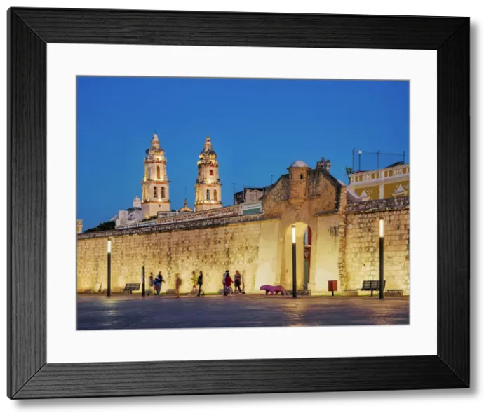 Framed Print : View over Plaza de La Republica towards Puerta de Mar and Defensive Wall of the Old Town, cathedral in the background, dusk, Campeche City, Campeche State, Mexico Framed Print : View over Plaza de La Republica towards Puerta de Mar and Defensive Wall of the Old Town, cathedral in the background, dusk, Campeche City, Campeche State, Mexico