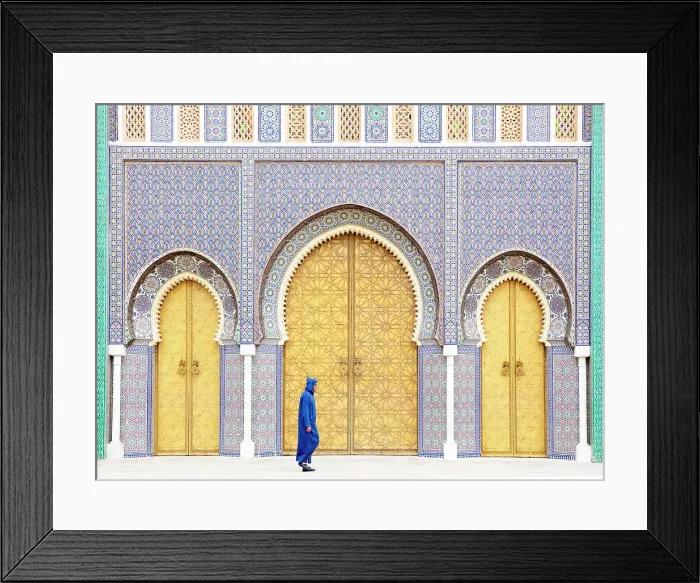 Framed Print : Local man wearing blue Djellaba walking past the golden doors of the Royal Palace, Fes, Morocco Framed Print : Local man wearing blue Djellaba walking past the golden doors of the Royal Palace, Fes, Morocco