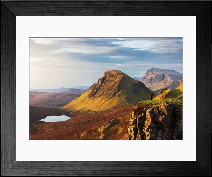 Framed Print : A tourist observes mountains from Quiraing viewpoint during sunrise, Isle of Skye, Inner Hebrides, Highlands, Scotland, United Kingdom (MR)