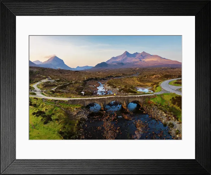 Framed Print : Aerial and panoramic view of a tourist on Sligachan Old Bridge observes Black Cuillin at sunrise, Isle of Skye, Inner Hebrides, Trotternish peninsula, Highlands, Scotland, United Kingdom (MR) Framed Print : Aerial and panoramic view of a tourist on Sligachan Old Bridge observes Black Cuillin at sunrise, Isle of Skye, Inner Hebrides, Trotternish peninsula, Highlands, Scotland, United Kingdom (MR)