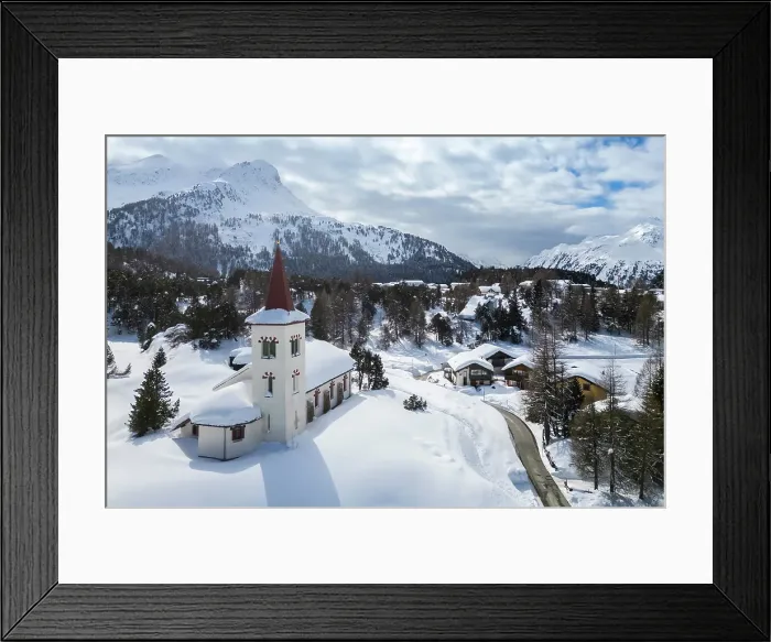 Framed Print : Aerial view of the Chiesa Bianca covered in snow. Maloja, Bregaglia, canton of Graubunden, Engadin, Switzerland Framed Print : Aerial view of the Chiesa Bianca covered in snow. Maloja, Bregaglia, canton of Graubunden, Engadin, Switzerland