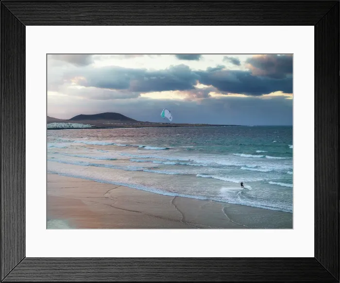 Framed Print : Aerial view of a man kitesurfing at Famara beach with Caleta de Famara in background, Caleta de Famara, Las Palmas, Lanzarote, Canary Islands, Spain Framed Print : Aerial view of a man kitesurfing at Famara beach with Caleta de Famara in background, Caleta de Famara, Las Palmas, Lanzarote, Canary Islands, Spain