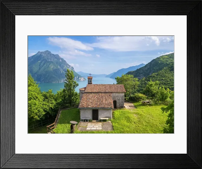Framed Print : small church of San Lorenzo dominating Lake Iseo in summer. Castro, Iseo Lake, Bergamo district, Lombardy, Italy Framed Print : small church of San Lorenzo dominating Lake Iseo in summer. Castro, Iseo Lake, Bergamo district, Lombardy, Italy