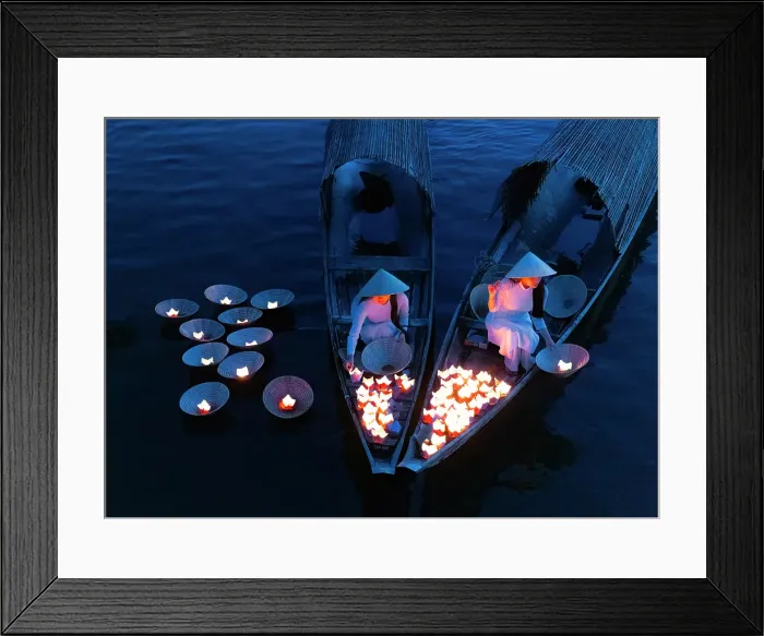 Framed Print : Women laying floating lanterns on the Perfume River at dusk, Hue, Central Vietnam