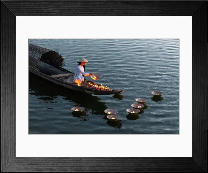 Framed Print : Woman laying floating lanterns on the Perfume River at dusk, Hue, Central Vietnam Framed Print : Woman laying floating lanterns on the Perfume River at dusk, Hue, Central Vietnam