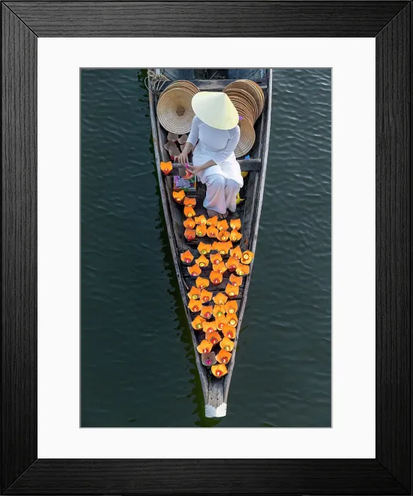 Framed Print : Woman laying floating lanterns on the Perfume River at dusk, Hue, Central Vietnam Framed Print : Woman laying floating lanterns on the Perfume River at dusk, Hue, Central Vietnam