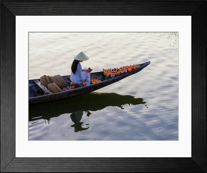 Framed Print : Woman laying floating lanterns on the Perfume River at dusk, Hue, Central Vietnam Framed Print : Woman laying floating lanterns on the Perfume River at dusk, Hue, Central Vietnam