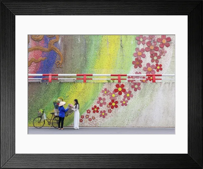 Framed Print : Flower seller and local woman at ceramic flower mosaic mural, Hanoi, Vietnam