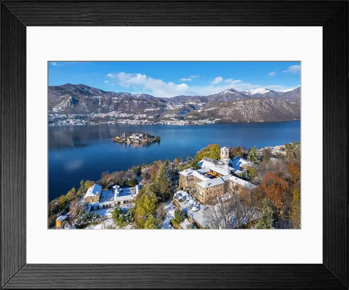 Framed Print : Sacro Monte of Orta and San Giulio island on Lake Orta in winter after a snowfall. Orta Lake, Province of Novara, Piedmont, Italy Framed Print : Sacro Monte of Orta and San Giulio island on Lake Orta in winter after a snowfall. Orta Lake, Province of Novara, Piedmont, Italy