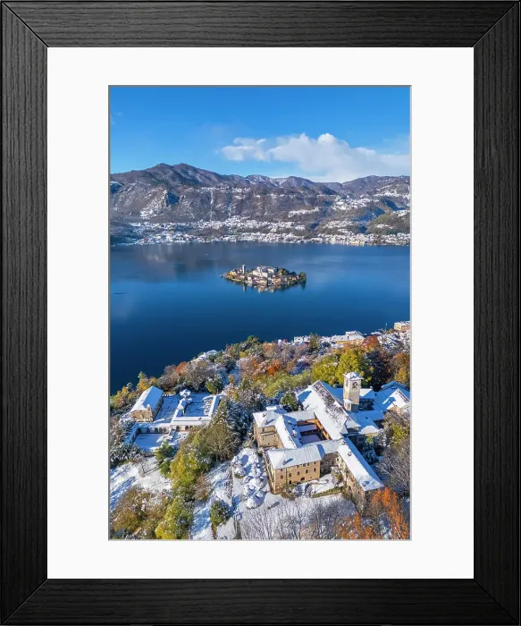 Framed Print : Sacro Monte of Orta and San Giulio island on Lake Orta in winter after a snowfall. Orta Lake, Province of Novara, Piedmont, Italy Framed Print : Sacro Monte of Orta and San Giulio island on Lake Orta in winter after a snowfall. Orta Lake, Province of Novara, Piedmont, Italy
