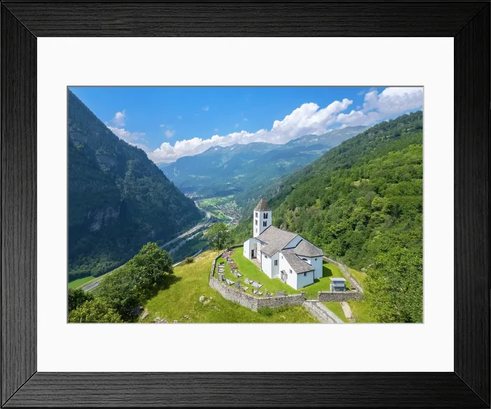 Framed Print : Aerial view of the church of Calonico, dominating Leventina valley towards San Gottardo pass. Calonico, district of Leventina, Canton of Ticino, Switzerland Framed Print : Aerial view of the church of Calonico, dominating Leventina valley towards San Gottardo pass. Calonico, district of Leventina, Canton of Ticino, Switzerland