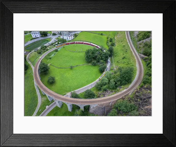 Framed Print : The Bernina Express passing on the spiral viaduct in Brusio, Val Poschiavo, Switzerland Framed Print : The Bernina Express passing on the spiral viaduct in Brusio, Val Poschiavo, Switzerland