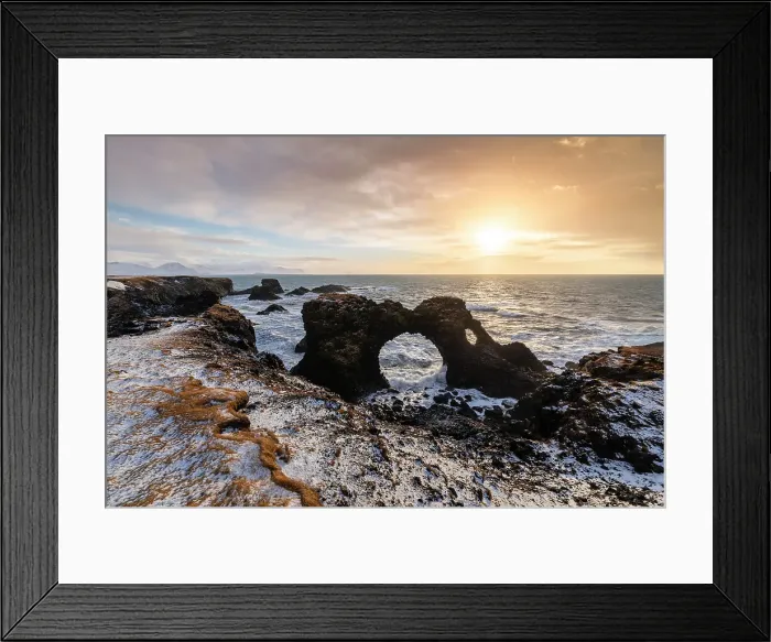 Framed Print : View of the Gatklettur rock arch at sunrise in winter. Arnarstapi, Hellnar, Snaefellsnes peninsula, Iceland