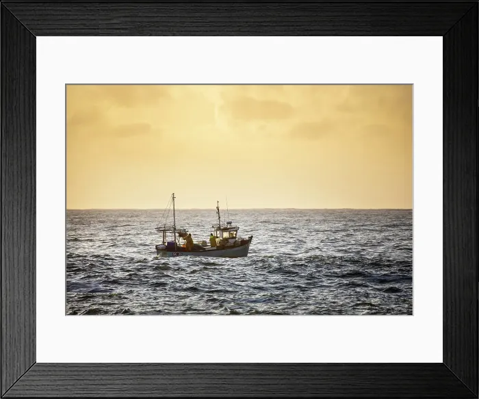Framed Print : Fishing trawler heading out to sea at sunrise, from Cadgwith, Lizard Peninsula, Cornwall, England Framed Print : Fishing trawler heading out to sea at sunrise, from Cadgwith, Lizard Peninsula, Cornwall, England
