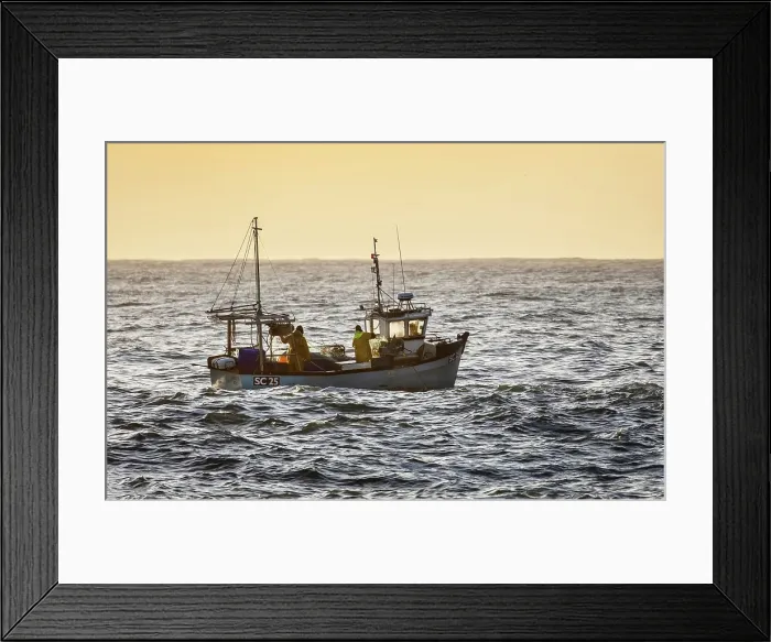 Framed Print : Fishing trawler heading out to sea at sunrise, from Cadgwith, Lizard Peninsula, Cornwall, England