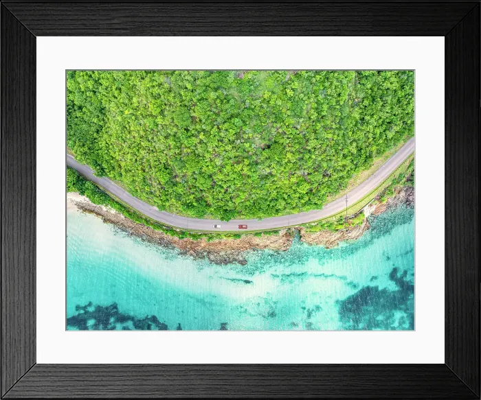 Framed Print : Cars traveling on a coastal road in between the crystal Caribbean sea and lush plants, aerial view, Antigua, Antigua & Barbuda Framed Print : Cars traveling on a coastal road in between the crystal Caribbean sea and lush plants, aerial view, Antigua, Antigua & Barbuda