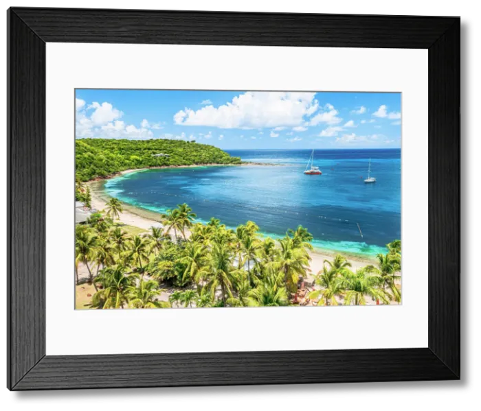 Framed Print : Boats moored in a tropical lagoon near the palm fringed Galleon beach, aerial view, English Harbour, Antigua, Caribbean