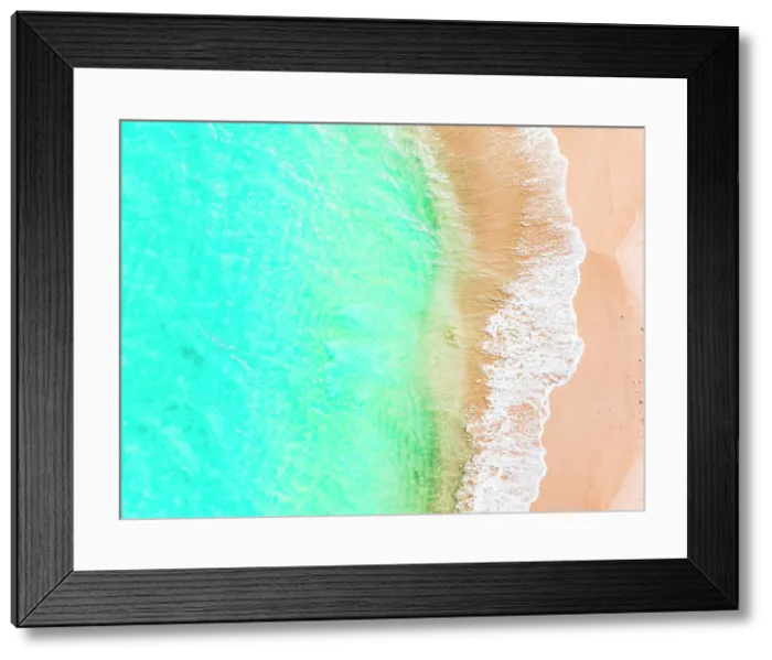 Framed Print : Waves of the turquoise sea washing a fine pink sand of exotic beach, aerial view, Barbuda, Antigua & Barbuda, Caribbean Framed Print : Waves of the turquoise sea washing a fine pink sand of exotic beach, aerial view, Barbuda, Antigua & Barbuda, Caribbean