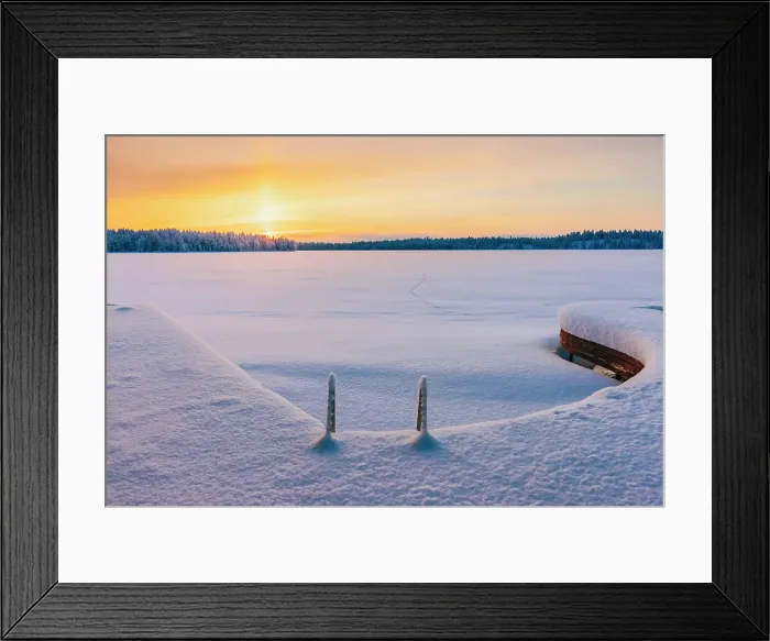 Framed Print : A frozen lake at sunset in a remote area near Ruka in finnish Lapland in winter landscape, Finland