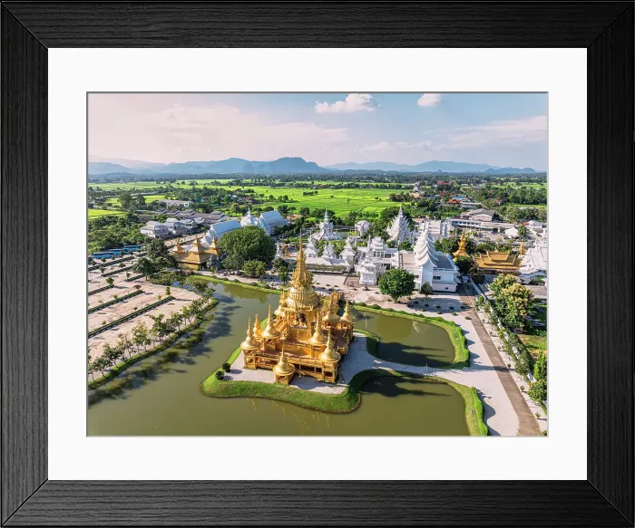 Framed Print : Aerial view of Wat Rong Khun also know as White Temple and golden stupa overlooking a lake, Chiang Rai, Thailand Framed Print : Aerial view of Wat Rong Khun also know as White Temple and golden stupa overlooking a lake, Chiang Rai, Thailand