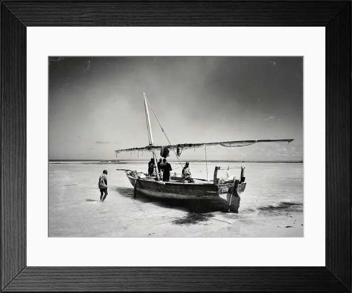 Framed Print : Local fishermen preparing their dhow for a fishing trip out at sea, Mkokotini, Zanzibar, Tanzania Framed Print : Local fishermen preparing their dhow for a fishing trip out at sea, Mkokotini, Zanzibar, Tanzania