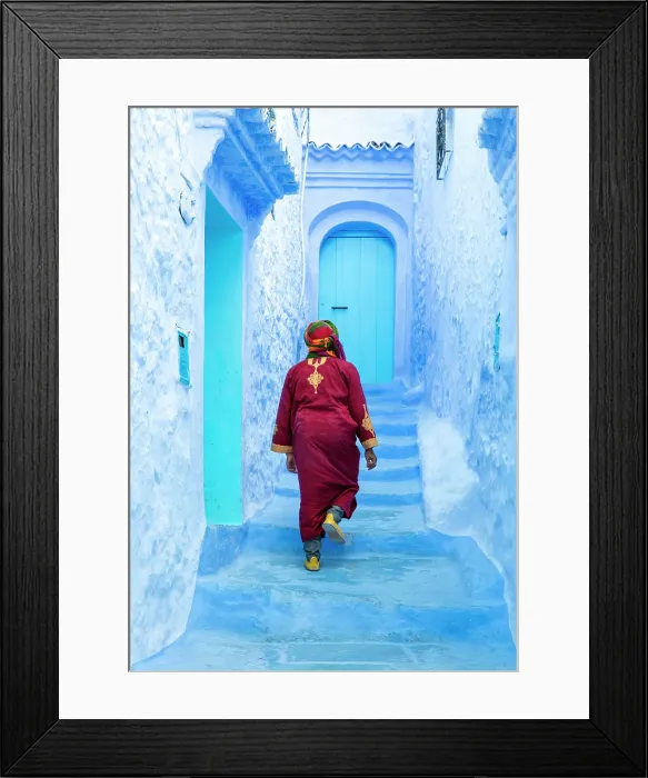 Framed Print : Local man wearing Djellaba walking up flight of steps in blue street, Chefchaouen, Rif Mountain, Morocco